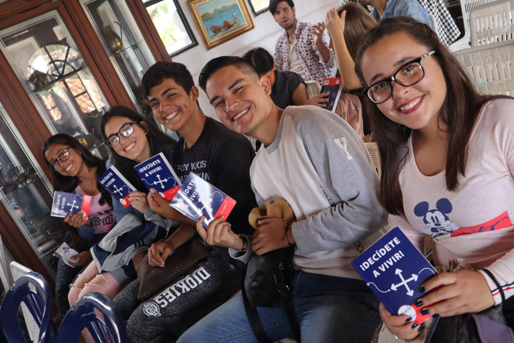 Latin American youth holding Reach4Life Bibles