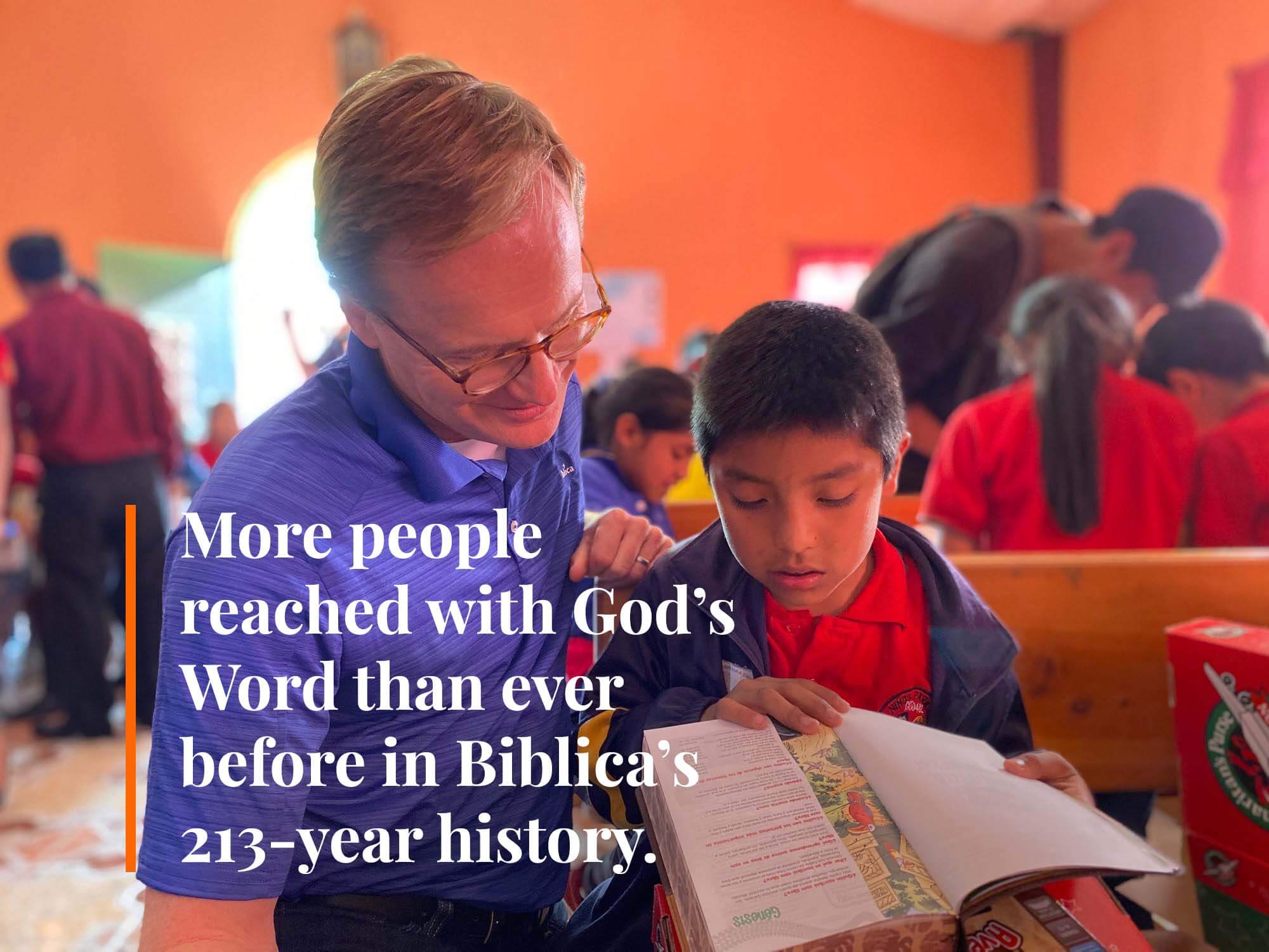 Geof Morin reading Bible with child